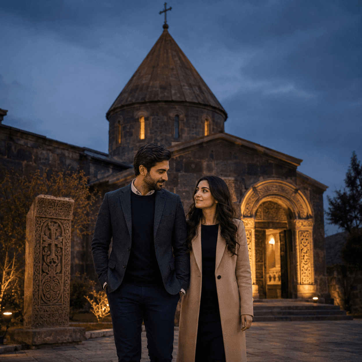 Couple walking outside a historic stone church at dusk